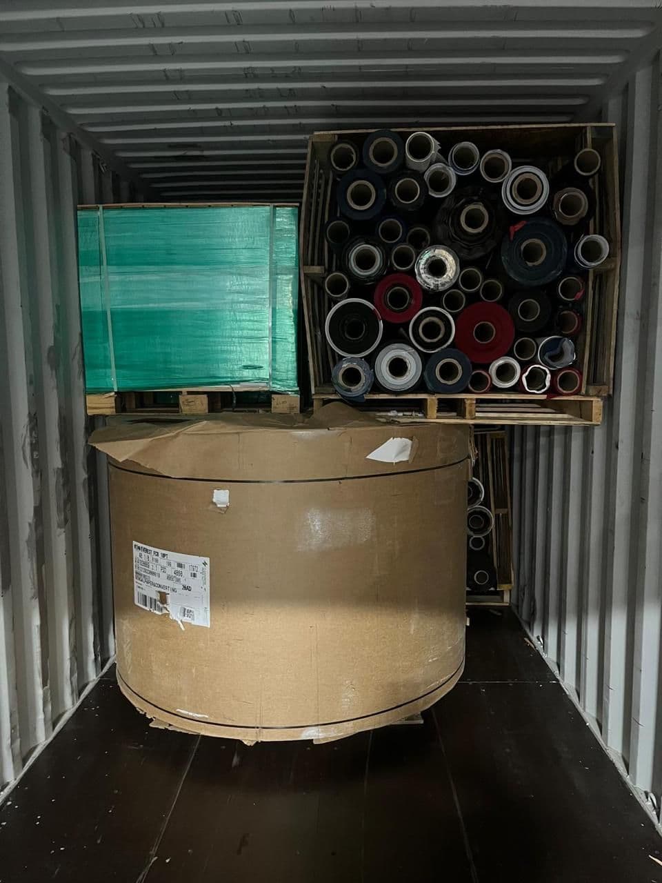 Shipping container loaded with paper stock for export